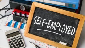 Image of a chalkboard with the words self-employed